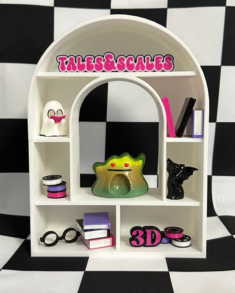 Small white shelf with various items against a black and white checkered background