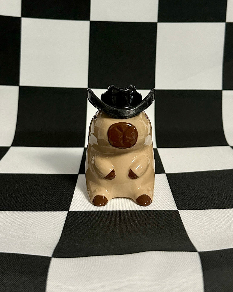 Small figurine on a black and white checkered background