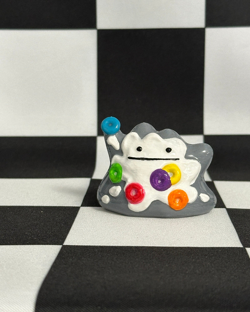 Colorful cartoon character with a checkered background
