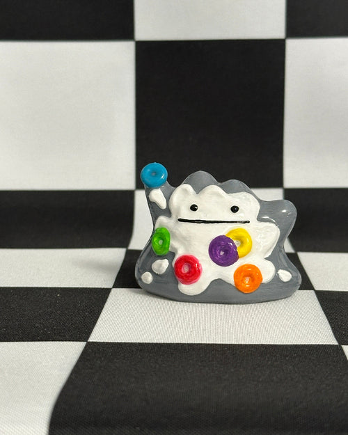 Colorful cartoon character with a checkered background