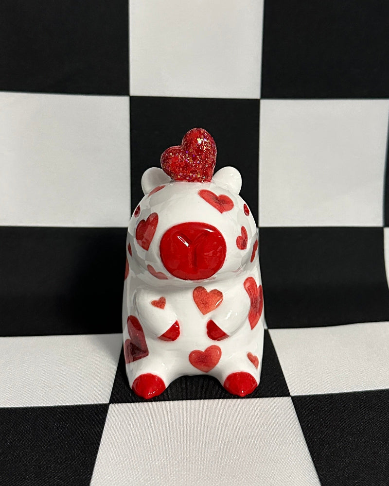 Decorative item with red hearts on a black and white checkered background