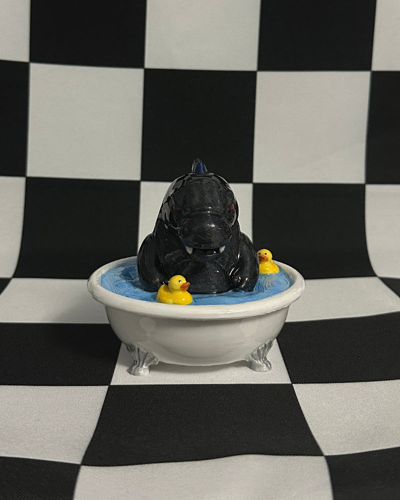 godzilla with yellow ducks in a white bathtub against a black and white checkered background