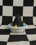 godzilla with yellow ducks in a white bathtub against a black and white checkered background