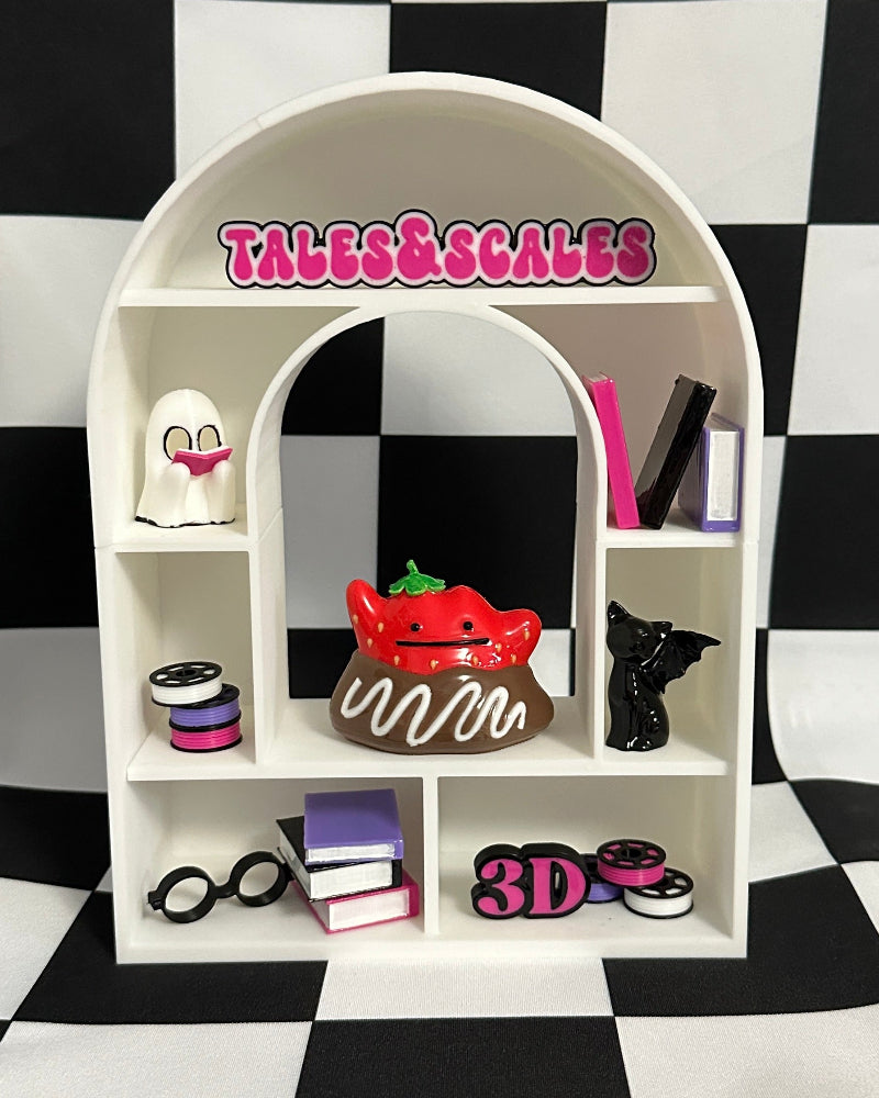 White arch-shaped shelf with various items against a black and white checkered background