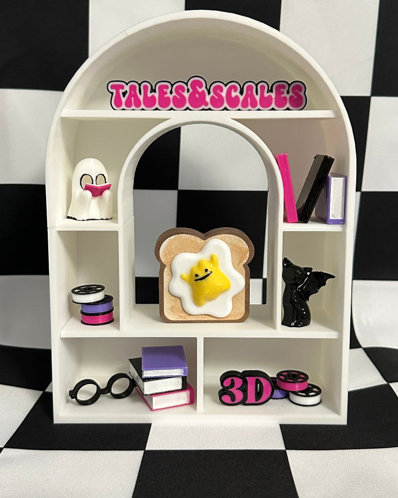 Small white shelf with various items against a black and white checkered background