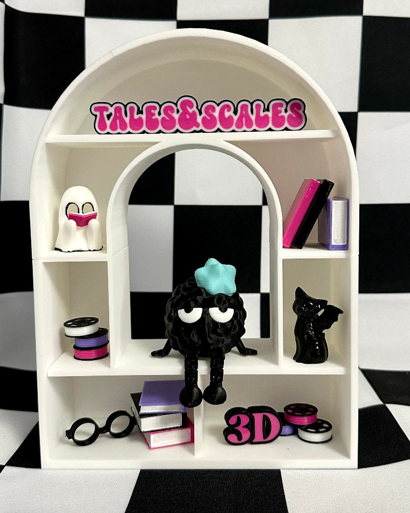 Toy display with 'Tales & Scales' branding against a checkered background