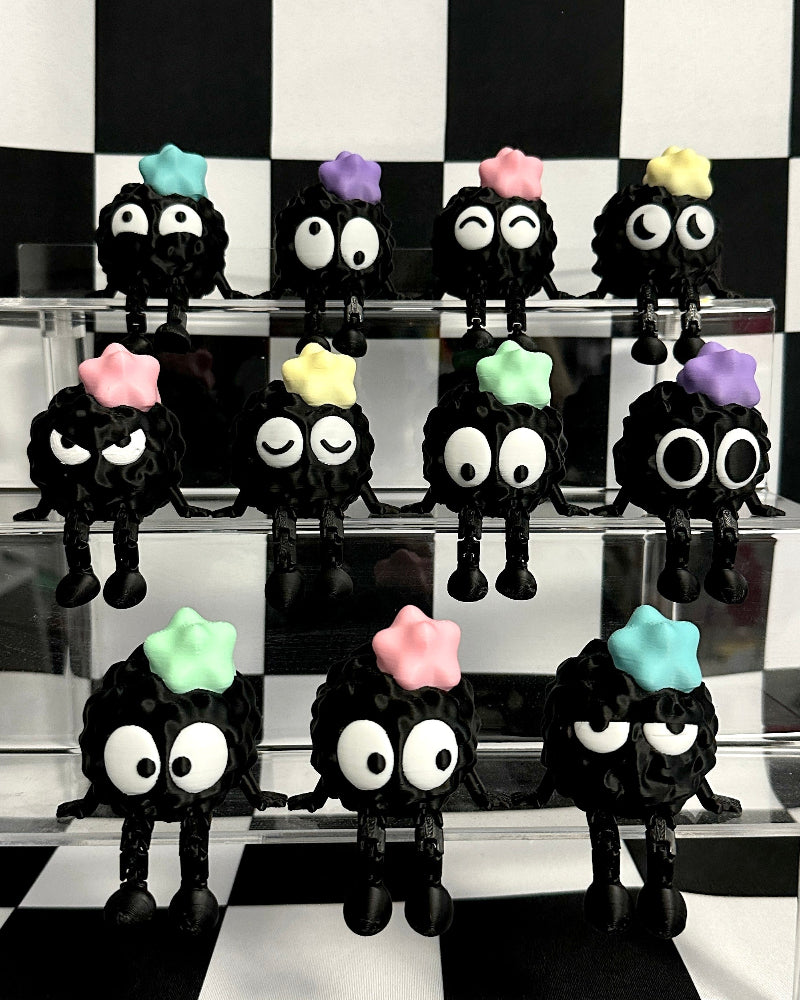 Black figures with colorful hats on a checkered black and white background