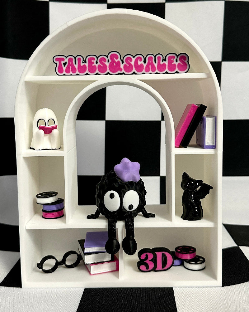 White shelf with decorative items against a black and white checkered background