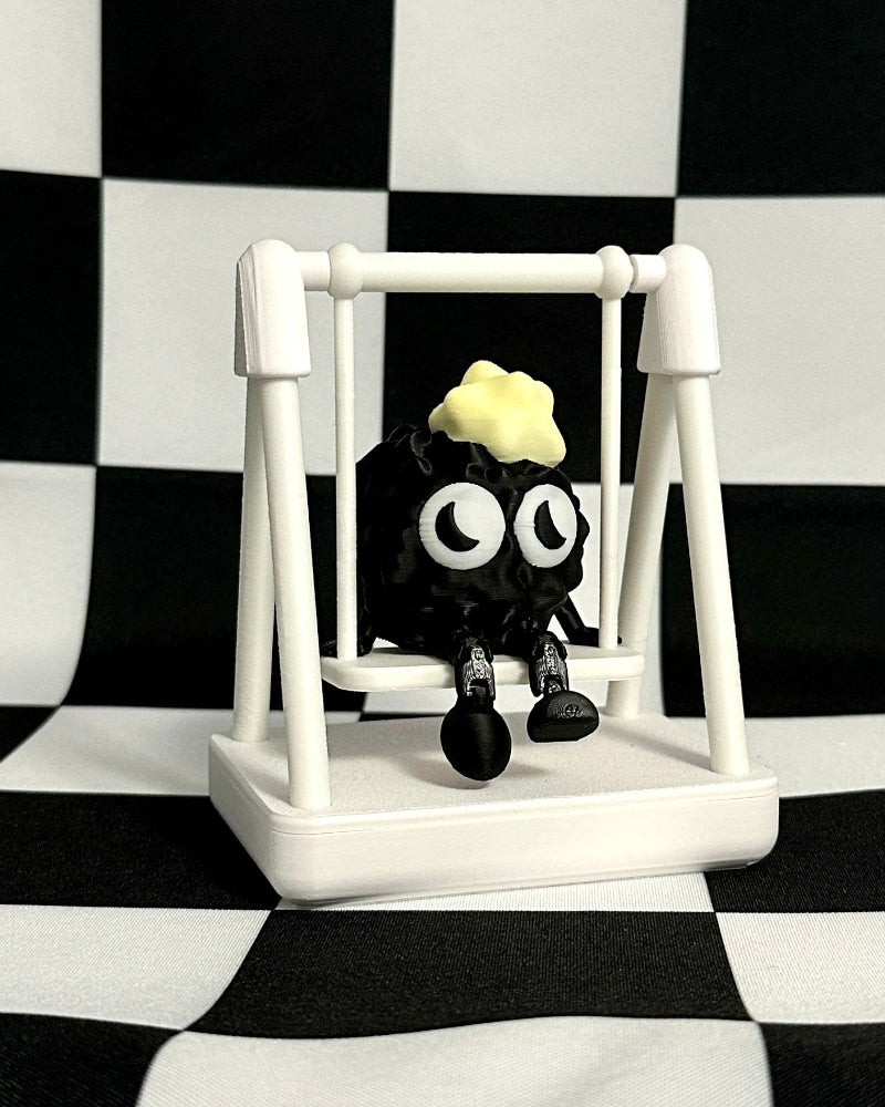 Small figure on a swing against a black and white checkered background