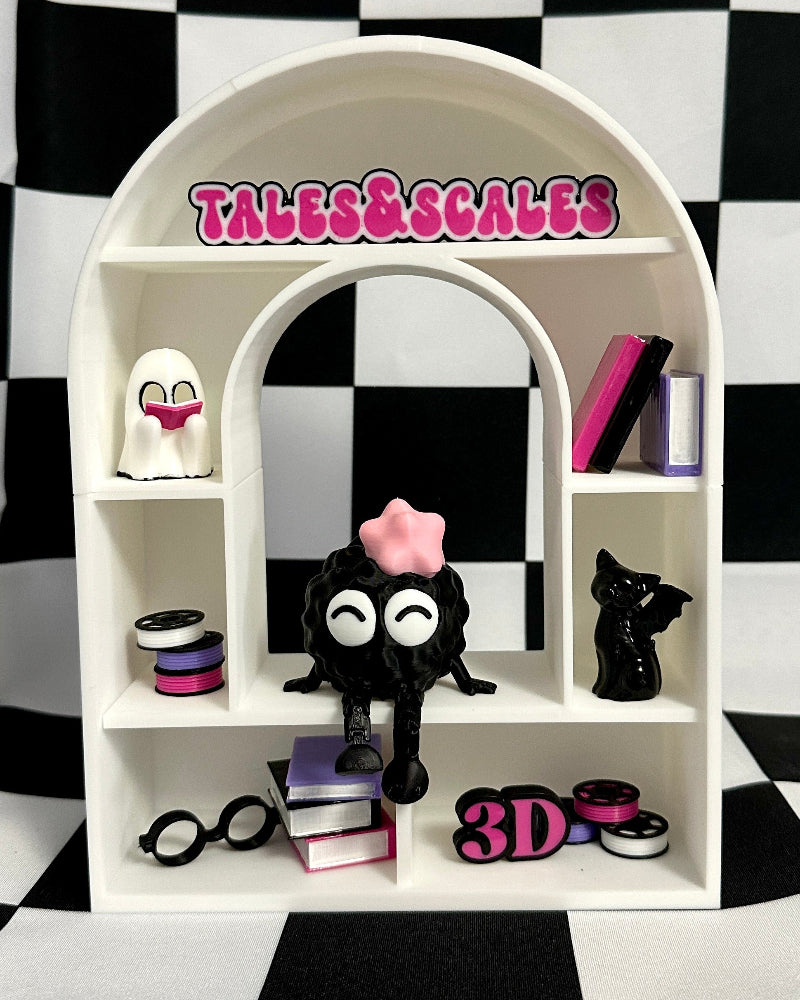 White shelf with decorative items against a black and white checkered background