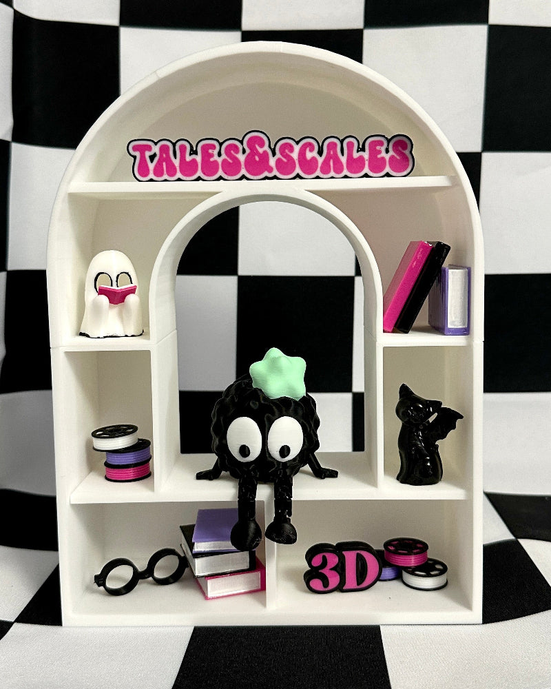 White shelf with decorative items against a black and white checkered background