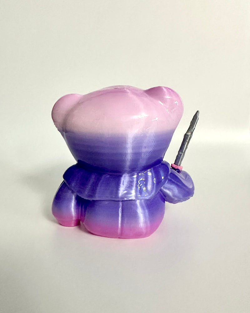 Gradient purple and pink figurine on a white background