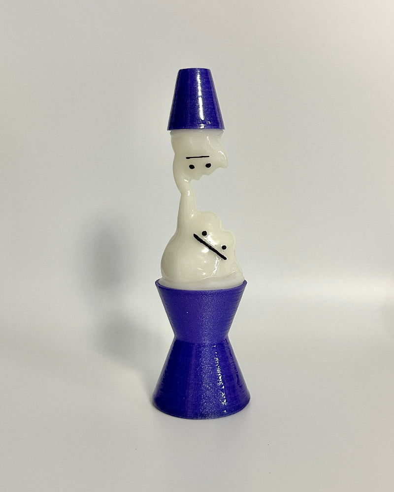 Small figurine with a blue top and white body on a white background