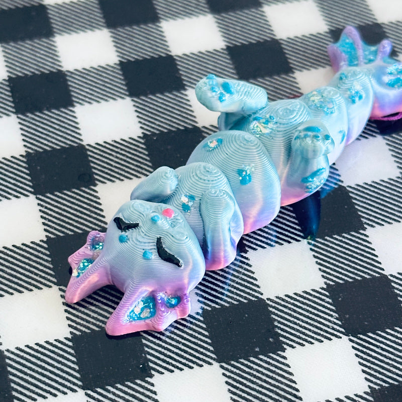 Meet TidalTwinkle the MerCat! A 3D-printed, hand-painted fidget collectible with silky teal and purple hues. Magical, calming, and perfect for ocean lovers! 