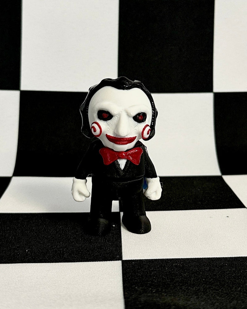 Toy figure in a suit on a black and white checkered background