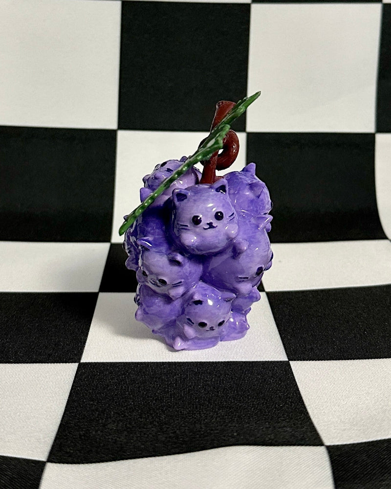 Purple decorative item on a checkered black and white background