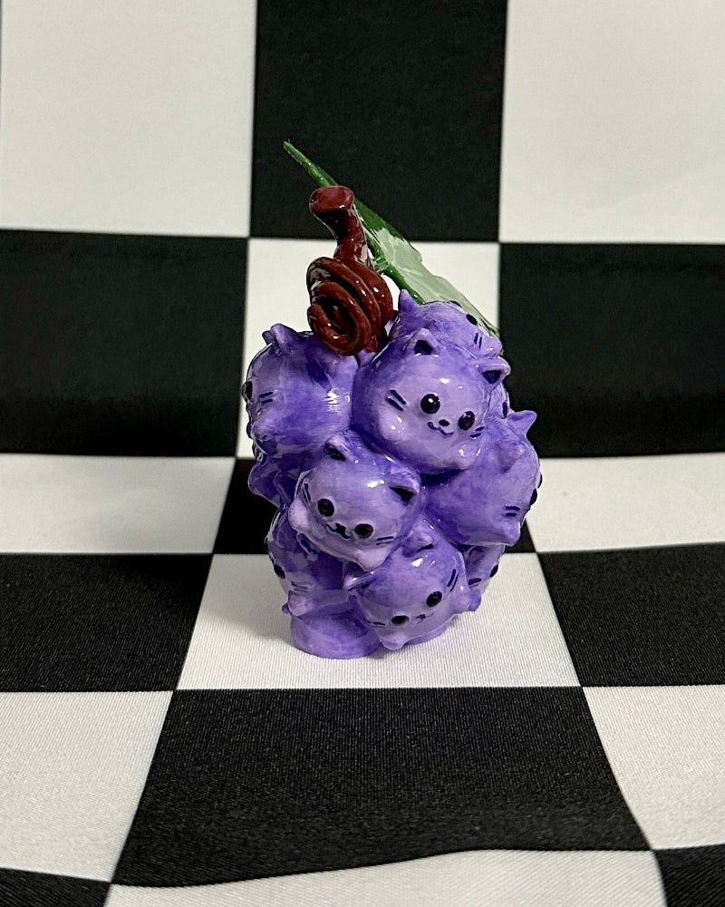Purple flower arrangement on a black and white checkered background