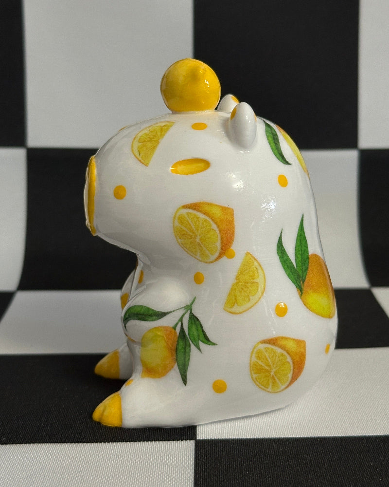 capybara with lemon design on a black and white checkered background