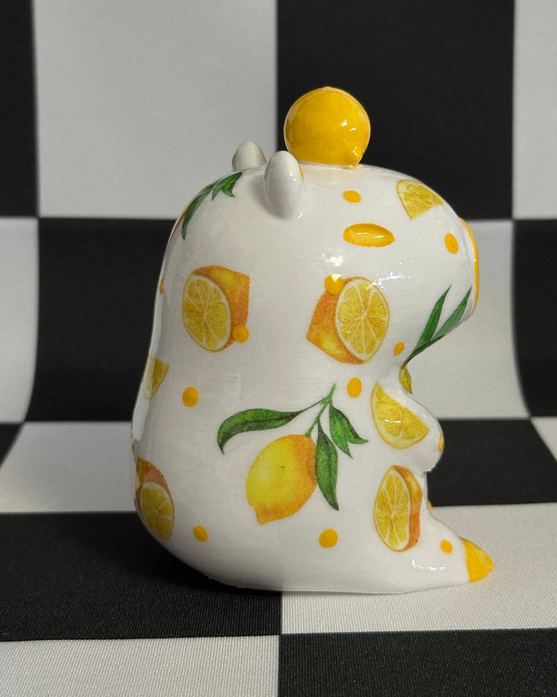 capybara with lemon design on a black and white checkered background