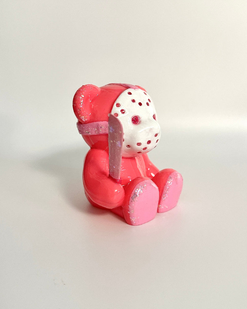 Pink cartoon character figurine with a white background