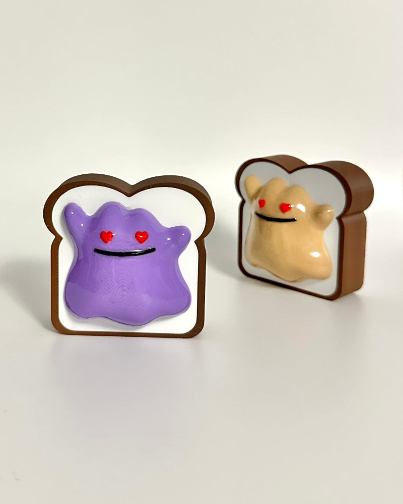 Two cartoon toast characters with faces on a white background