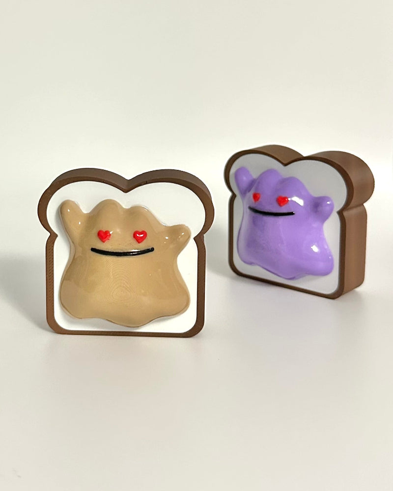 Two cartoon toast figurines with embedded characters on a white background