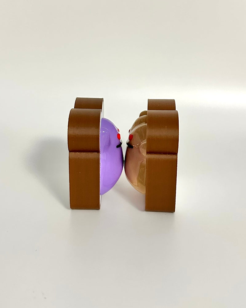 Brown square-shaped object with a purple center on a white background