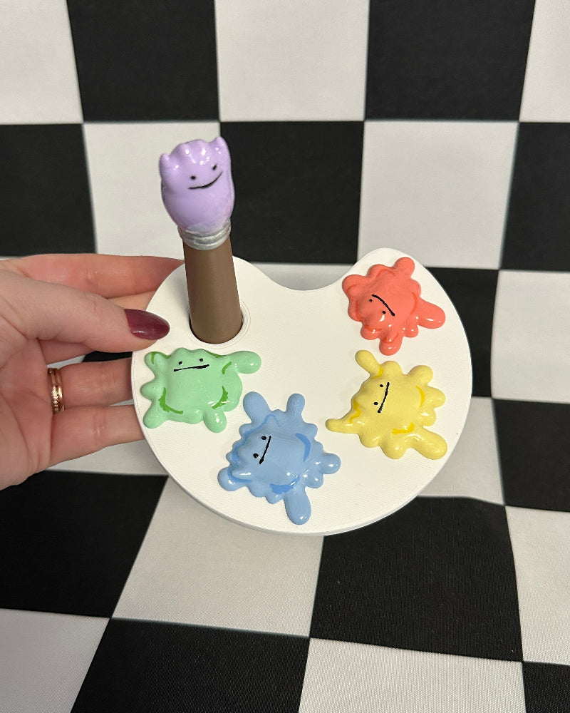 ditto blobs shaped like cartoon faces on a checkered background