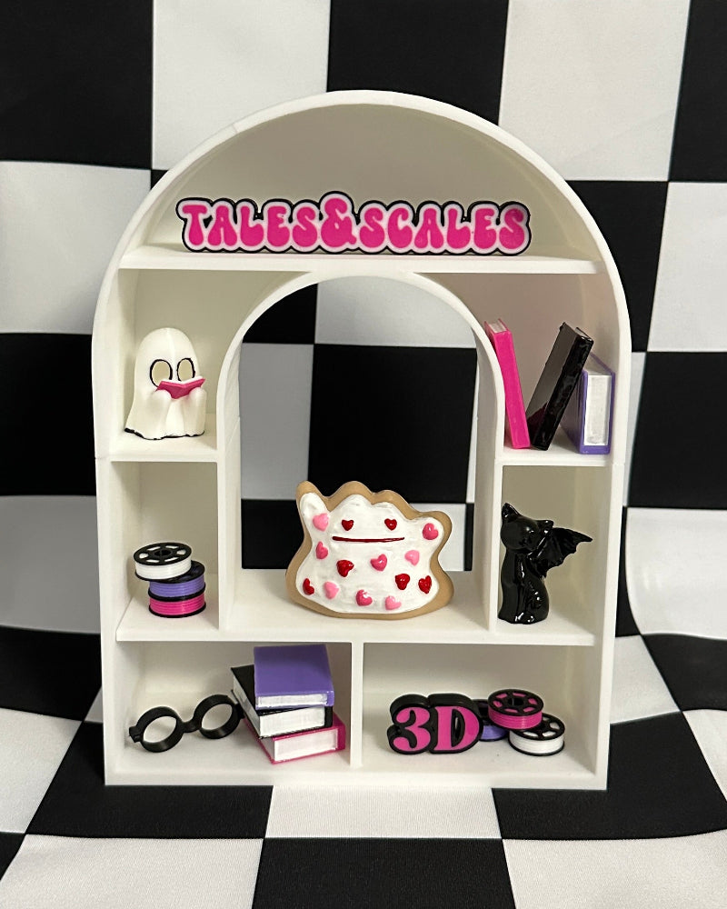 Small white shelf with various items on a black and white checkered background