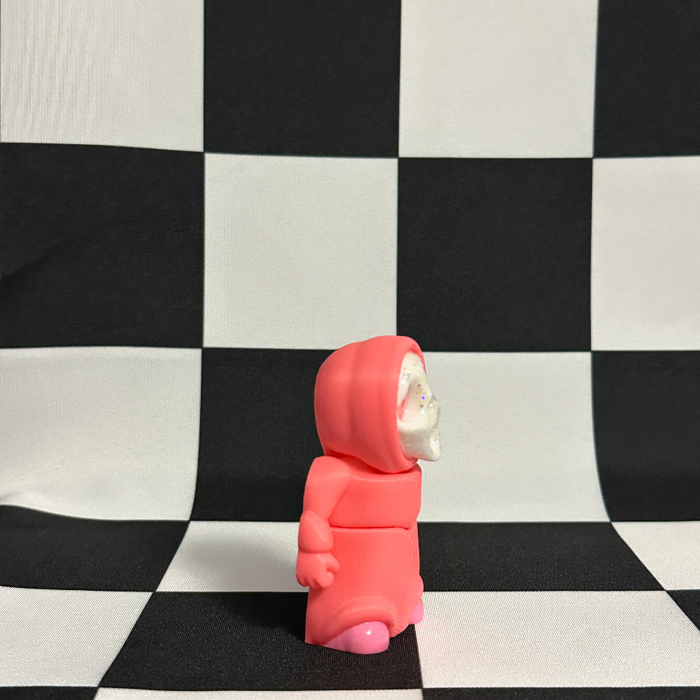 Pink hooded figure on a black and white checkered background