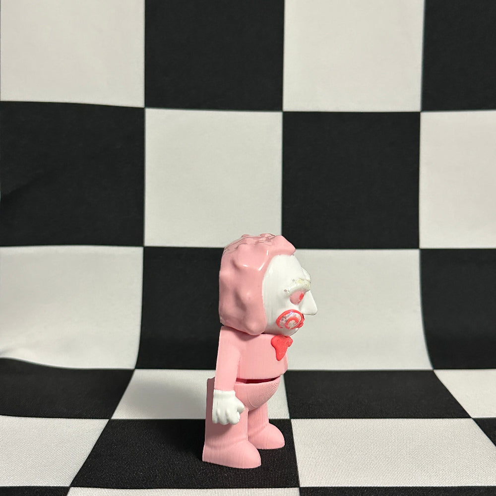 Pink and white character figure on a black and white checkered background