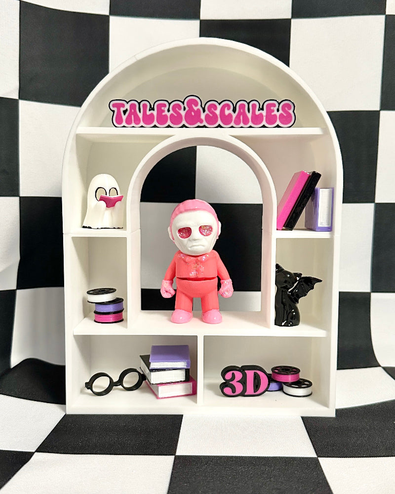 Small white shelf with various items against a black and white checkered background