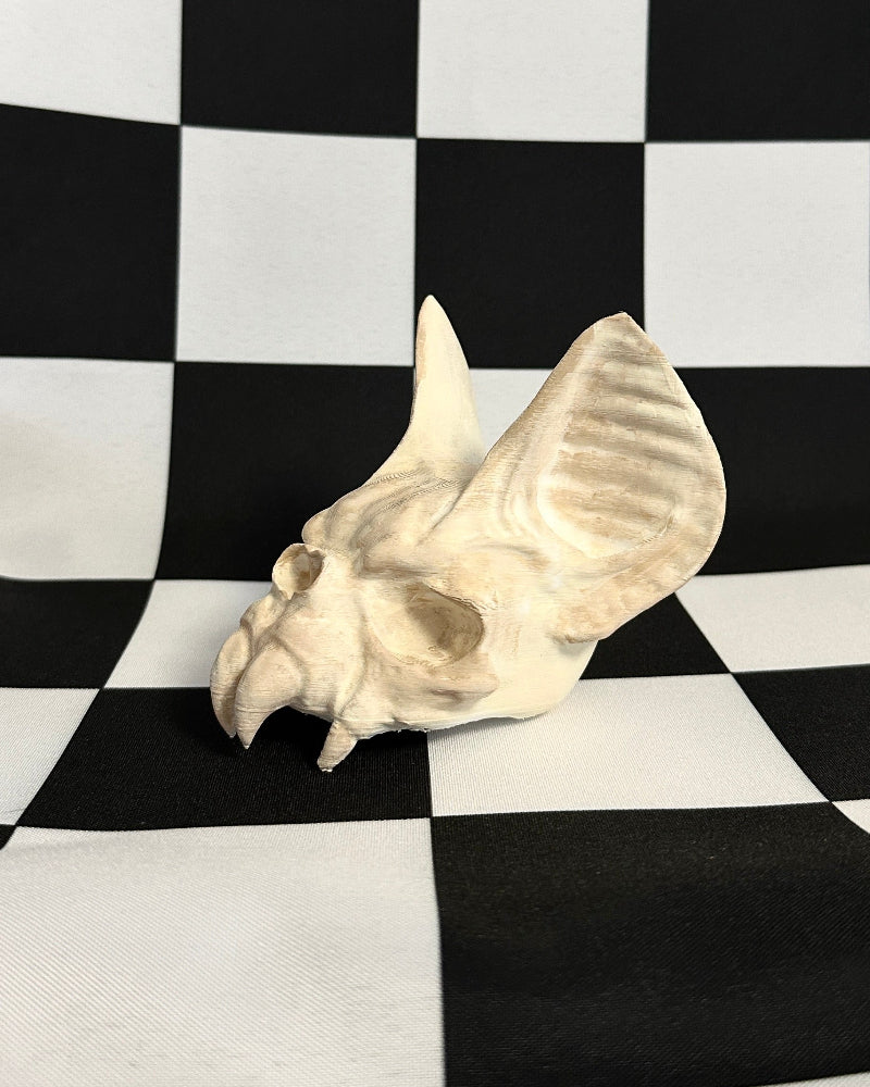 bat Skull on a black and white checkered background