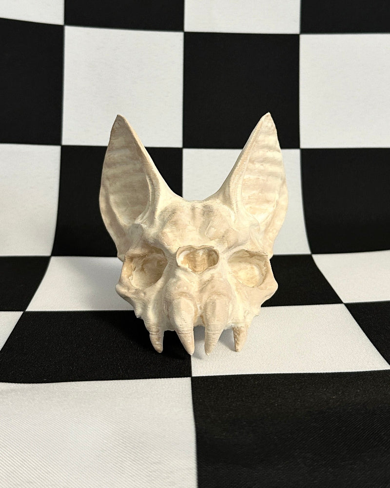 bat skull on a black and white checkered background