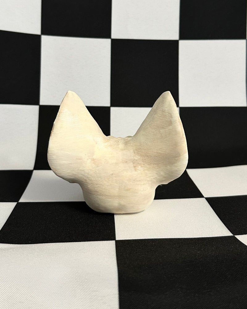 bat skull on a black and white checkered background