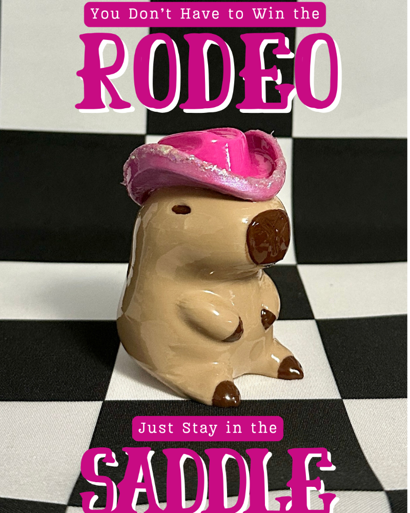 Decorative piggy bank with cowboy hat on a black and white checkered background with humorous text.